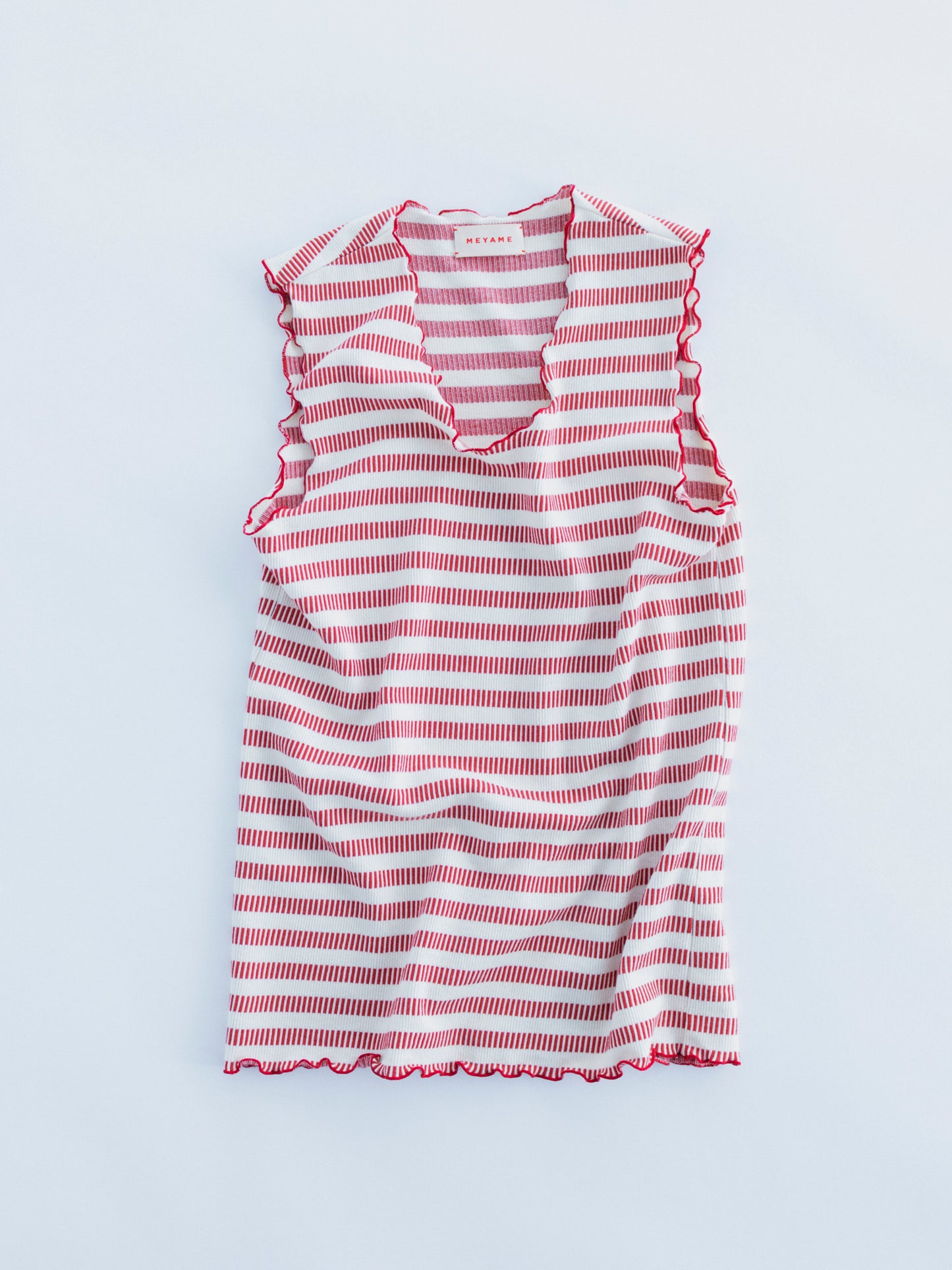 BORDER SLEEVELESS